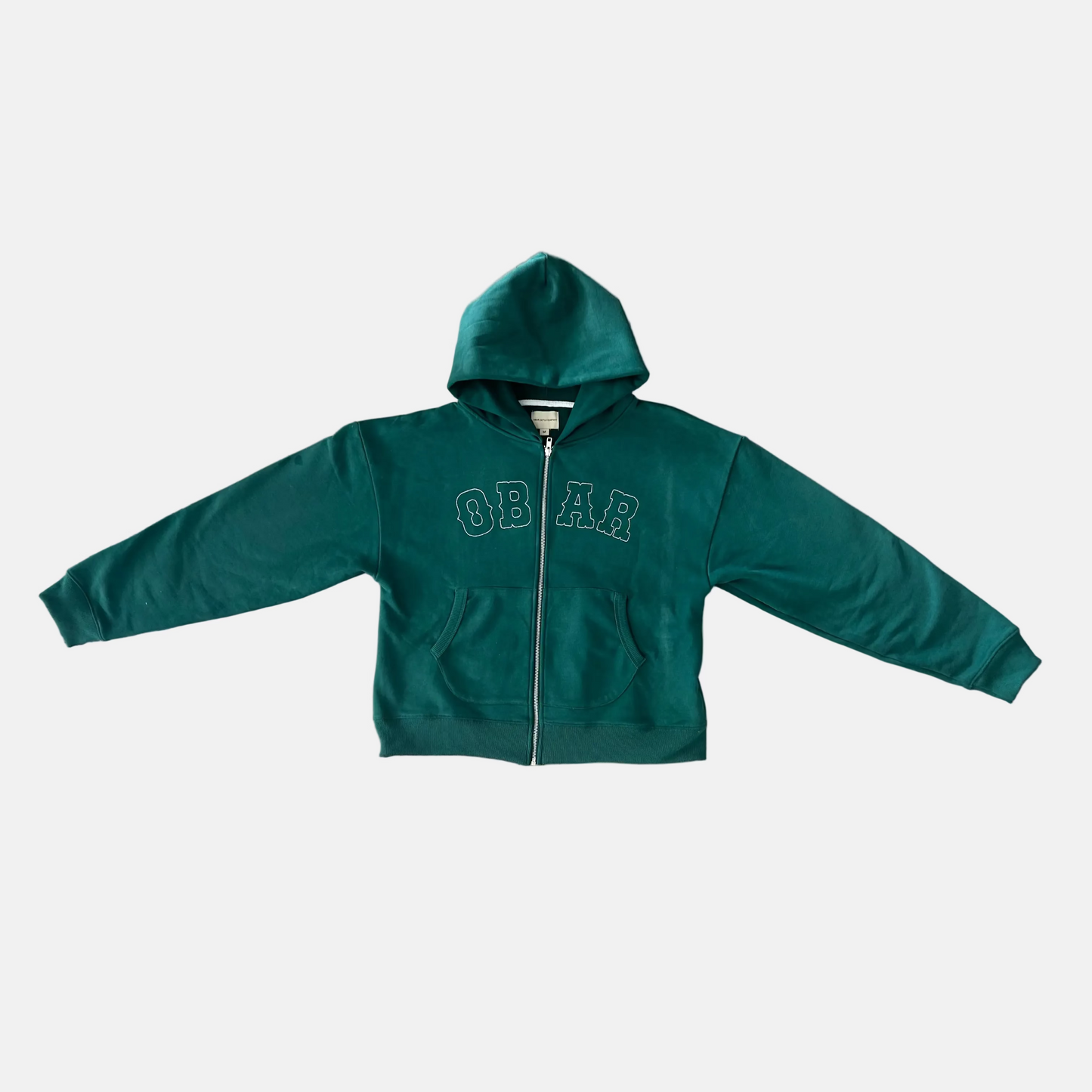 Green hoodie with white embroidery on a light grey background